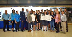 July 2021 Publisher’s Message 2019 USO Check Presentation JFK Airport