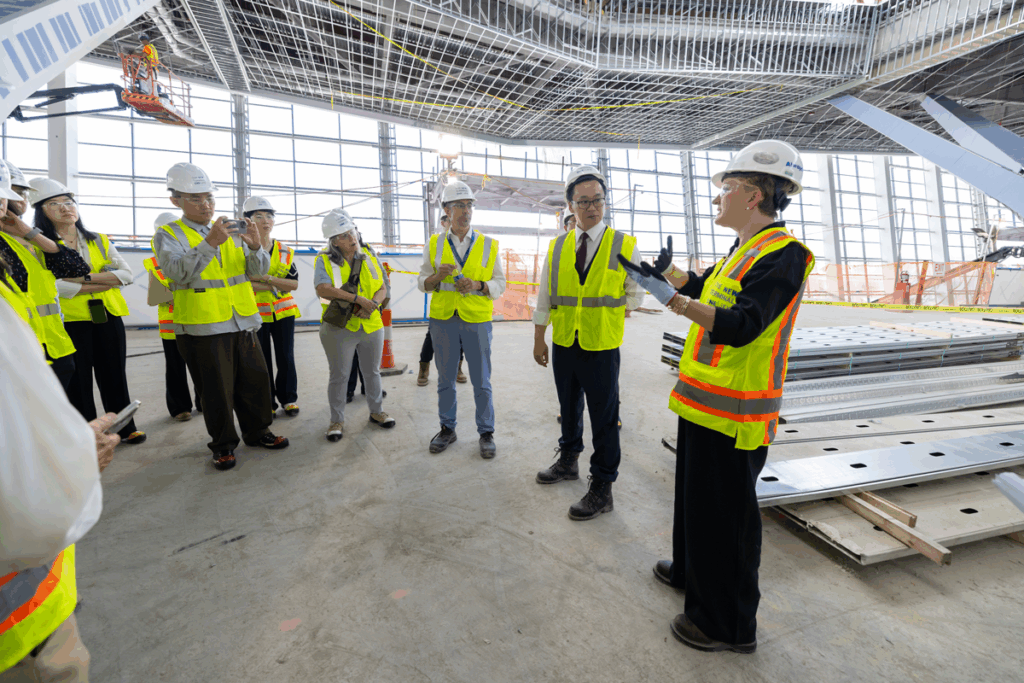 Touring the New Terminal One New York Airport Jennifer Aument, CEO of the New Terminal One, explains some of the terminal's features, including expansive, naturally-lit public spaces, airy check-in halls, green spaces, ADA-compliant cutting-edge technology, and a centralized security checkpoint.