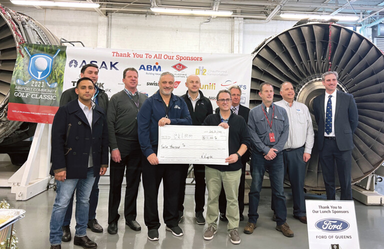 Airport Community Golf Classic committee members, along with sponsors ASAK Solutions and Ford of Queens, pose with one of two $12,000 checks donated to the Aviation High School Education Foundation and the Council of Airline Maintenance Managers (CALMM).