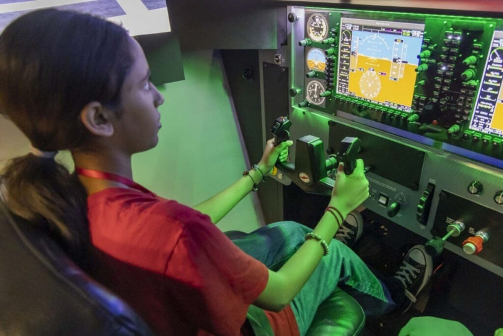 Students in the JFK Aviation and Aeronautics Academy at York College train on the college's flight simulators.