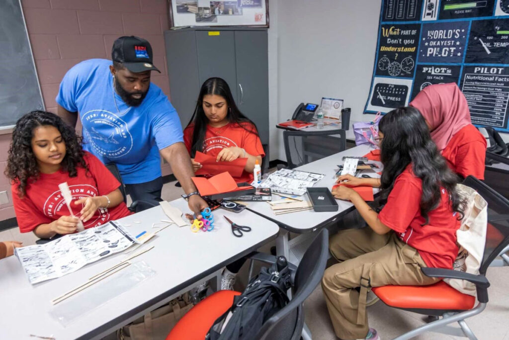 Instructor Omar Anderson, a certified flight instructor, working with students.