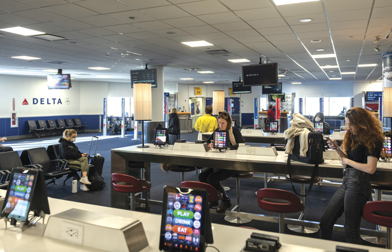 Passengers wait at LaGuardia airport to 
board their flights out of New York City. 