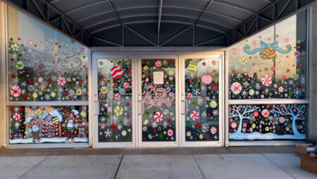 Spreading Holiday Cheer at JFK International Airport… On Glass American Airlines Hangar 10 at JFK Airport.