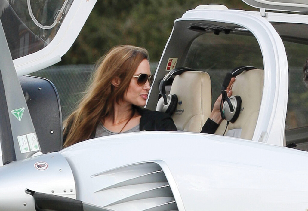Angelina Jolie in the pilot seat as she prepares to take off from Blackbushe Airport in Hampshire, England.