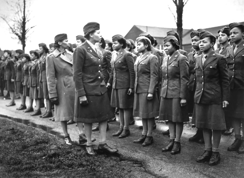 “No Mail, Low Morale” The Six-Triple-Eight Delivered! Major Charity Adams & Capt. Mary Kearney inspect the first contingent of the 6888th to arrive in England in February 1945. (National Archives)