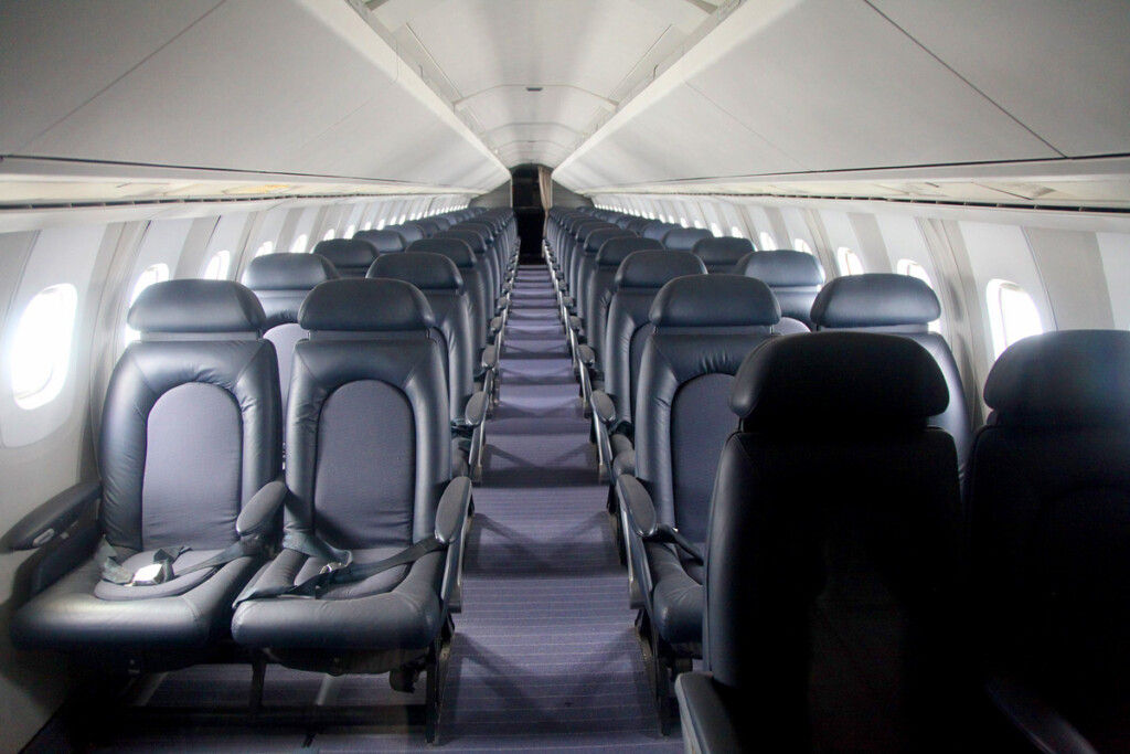 British Airways Concorde interior. The narrow fuselage permitted only a 4-abreast seating with limited headroom.