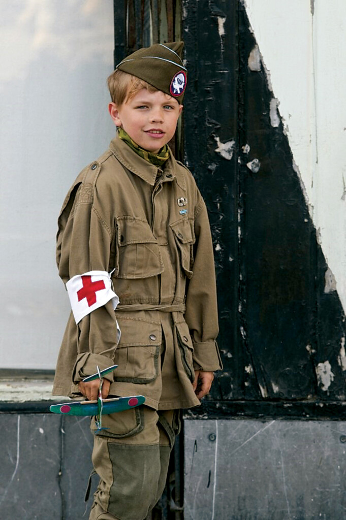 D-Day: The Day Each Year Europe Celebrates The Beginning of Their Liberation New York Airport A French boy dressed as a U.S. Paratrooper smiles for a photo during D-Day celebration at Ste. Marie Eglise