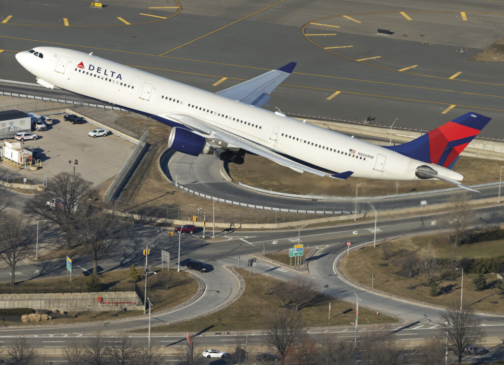 Looking Up! A Passion for Plane Spotting New York Airport An air-to-air shot of a Delta A330 banking out of JFK Airport.