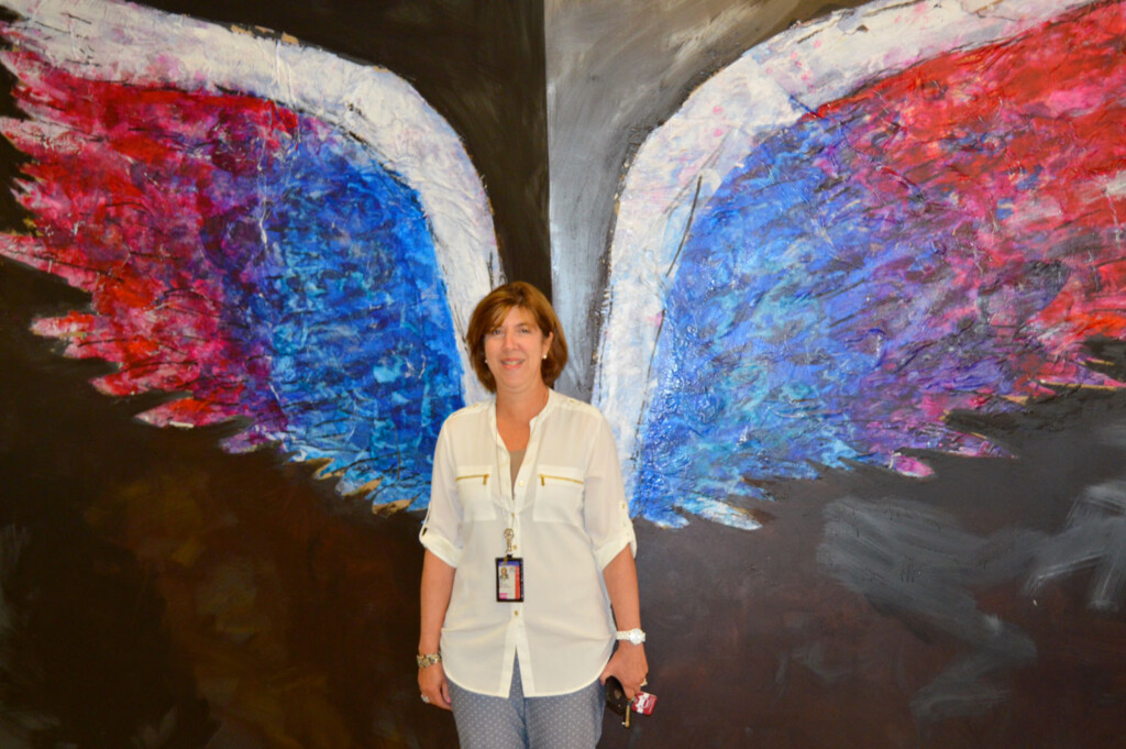 American Artist Inspires Travelers with Painted Angel Wings at Newark Liberty International Airport Diane-Papaianni
