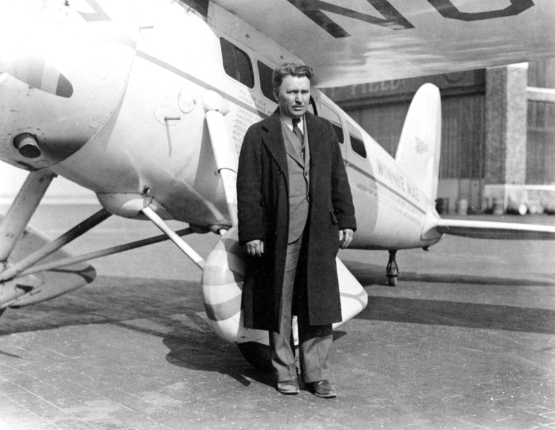 Wiley Post posed by ‘Winnie Mae’ at Floyd Bennett Field, 1935.