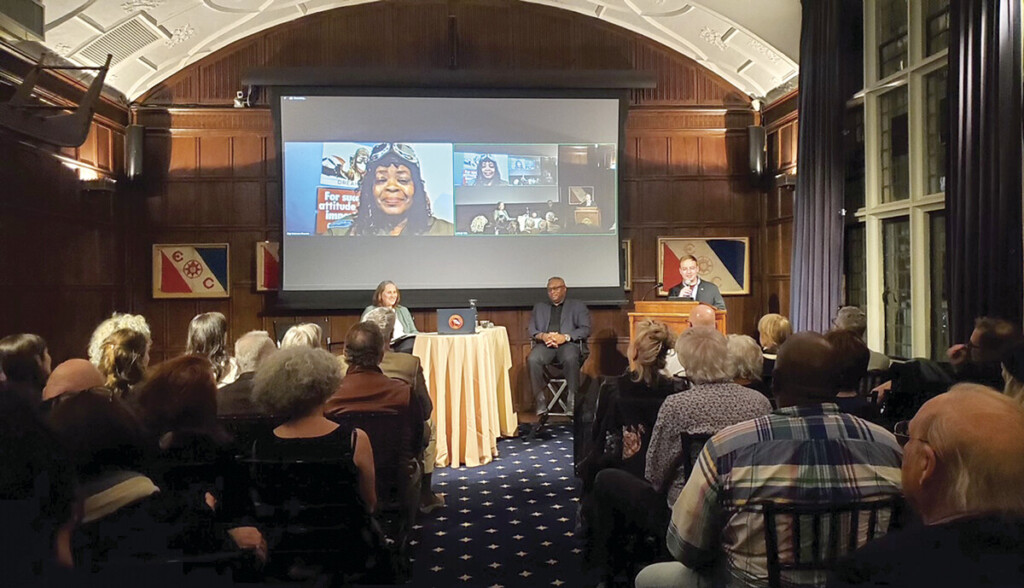 At the podium, Paul Tanghe, a member of the Explorer’s Club, introduced Gigi Coleman Brooms, Ian Howe, and moderator Julia Lauria-Blum.