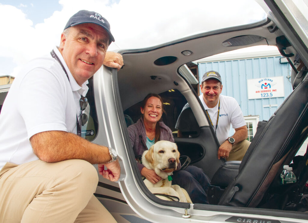 Behind the Scenes of a Compassion Flight New York Airport Army Captain Theresa Reer, finds strength and support from her new best friend, Oscar. Free veteran flights from PALS made sure the two got togther.