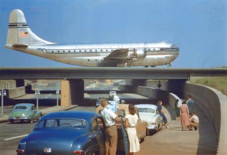 Idewild-Kennedy Pan-American Boeing 377-Stratocruiser taxiis on Idlewild Van-Wyck Expressway overpass-c.1951. (National Archives)