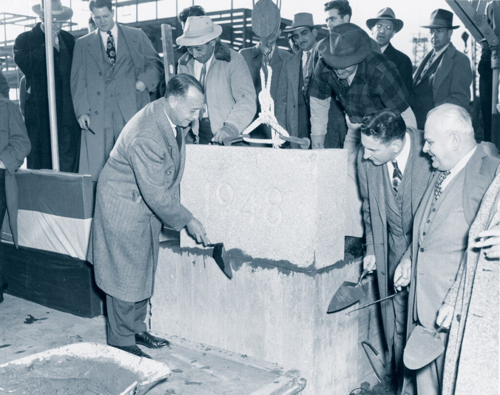 PANYNJ Celebrates 100th Anniversary New York Airport Port Authority Chairman Howard S. Cullman laying cornerstone of Federal Building at Idlewild Airport. D. Rentzel C.A.A. Admin. & Ora Young C.A.A, Regional Admin. looking on. November 8, 1948