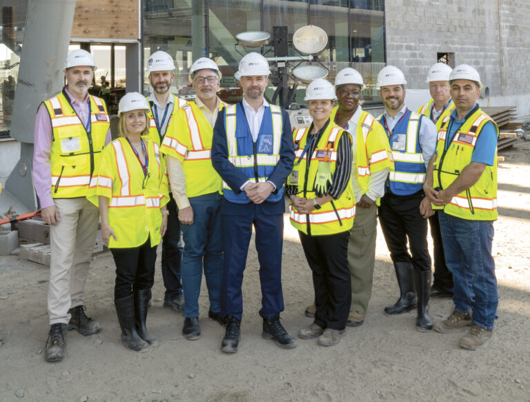 (L.-R.): Derek Thielmann, Vice President, Design & Construction / Project Director; Jennifer Janzen, Communications Director; John Girardi, Deputy Director, Design & Construction; Ed Ratuski, Acting COO; Steve Thody, CEO; Kasia Sek, Director, Operations Planning & Implementation; Sade Olanipekun-Lewis, Vice President, Operating & Community Partnerships; Rob Manniello, Senior Director, Operations; Ted Walters, Director, Facilities & Technology; Fazal Bangash, Civil Site Supervisor, Terminal 6 Construction.