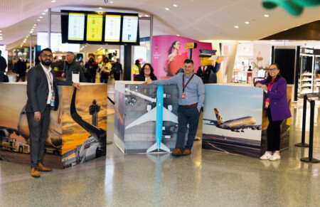 PANYNJ and JFKIAT Unveil Art Installations By Local Artists at JFK T4 Vincenzo Pace, Director of Airport Solutions at Unity Electric, posing with his aerial photography on display at T4 at JFK.