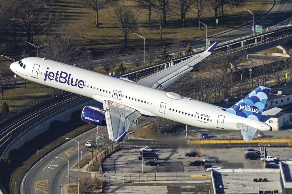 Looking Up! A Passion for Plane Spotting New York Airport An air-to-air shot taken from a helicopter of
a jetBlue A321neo banking out of JFK Airport.