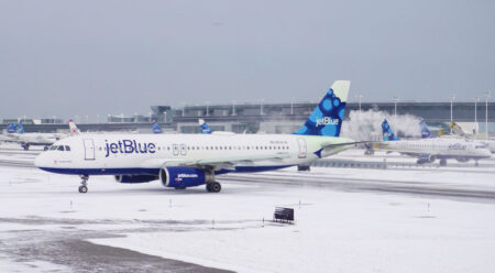 JetBlue Weighs Merger Options With Alaska, Southwest, and United JetBlue Snow on the ground at the Airport