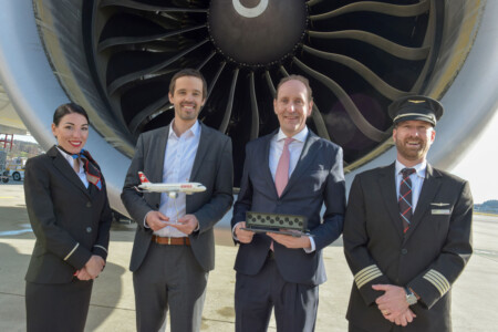 Jan Wurzbacher, co-founder and co-CEO of Climeworks, and SWISS CEO Dieter Vranckx, flanked by a SWISS crew at Zurich Airport in February 2024.