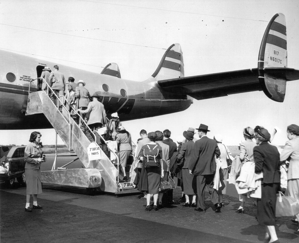 An Aviation Chronicle New York Airport LaGuardia Passengers Boarding TWA Constellation departing for Paris. Carried 62 on Trans Atlantic crossings. Flight crew of 5 plus several stewardesses c.1947 8.28.170 1 Metropolitan Airport News