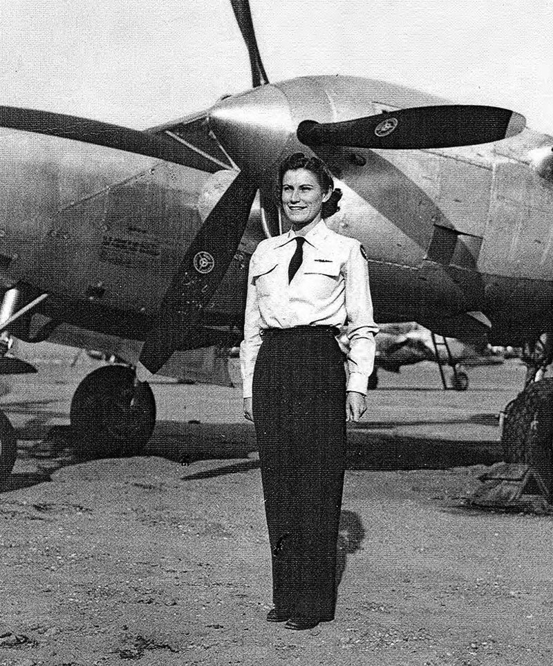 Iris Cummings Critchell, Olympian, Aviator, & Trailblazer New York Airport Iris Cummings Critchell poses next to a P-38, many of which she ferried across the U.S. mostly to Newark, N.J. (Library of Congress)