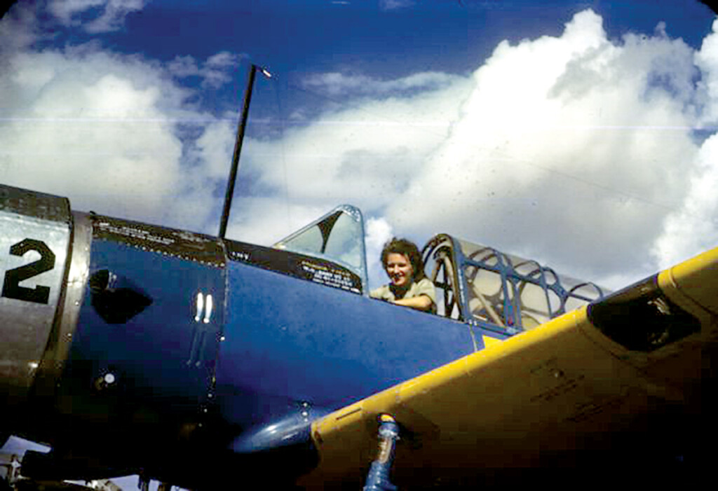 Lillian Lorraine smiles from the cockpit