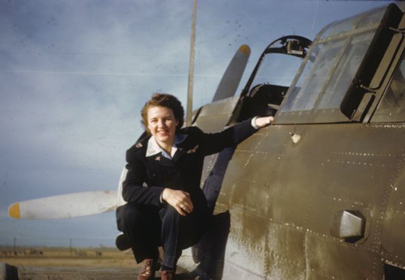 Lillian in WASP uniform, on the wing of a Douglas Dauntless, 1944.