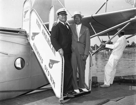Sikorsky S-42 crew member posing with a passenger at the Port Washington Air Service Dock.