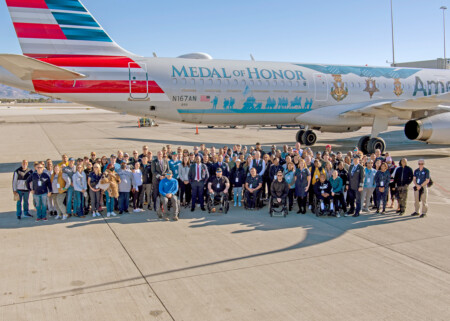 Around 190 participants pose for a photo outside Flagship Valor.