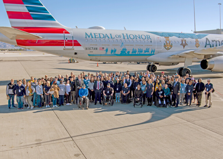 All-Veteran Crew Flies Flagship Valor for Salute to the Troops Event Around 190 participants pose for a photo outside Flagship Valor.