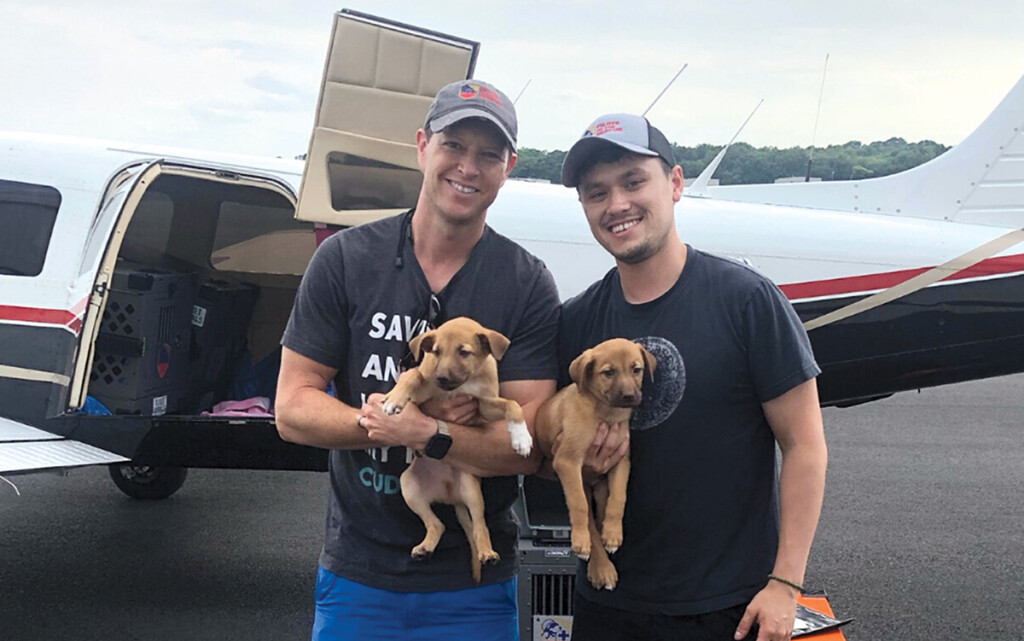 Flights to the Rescue! New York Airport Pilot, M. Schneider (L) and Co-Pilot D. Baumel, on rescue flight of 16 dogs from Texas to Manassas, VA.