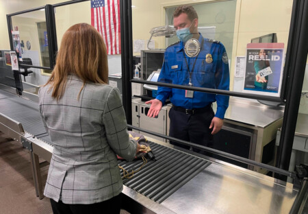 A TSA officer at New York Stewart International Airport offers some guidance to a traveler.