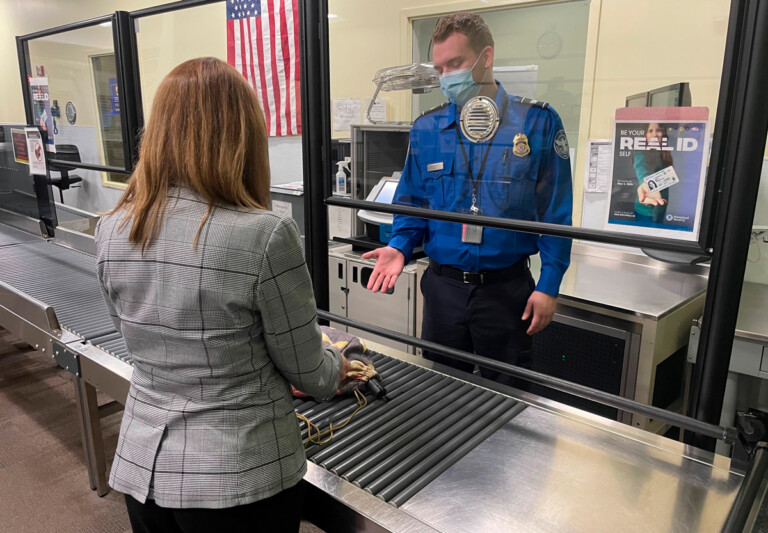 A TSA officer at New York Stewart International Airport offers some guidance to a traveler.